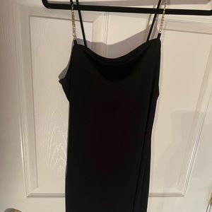 4. Black dress with rhinestone strap and angled bottom with fringe